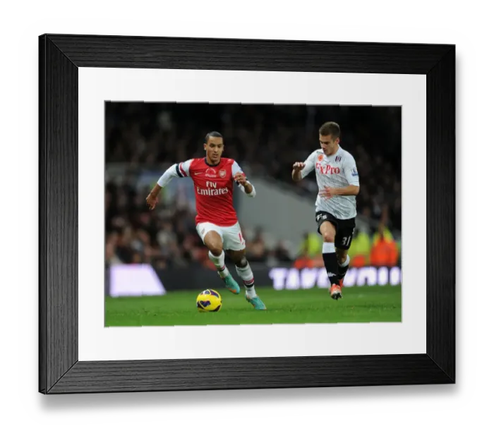Framed Print : Theo Walcott vs. Alex Kacaniklic: A Premier League Showdown at Emirates Stadium (2012-13)