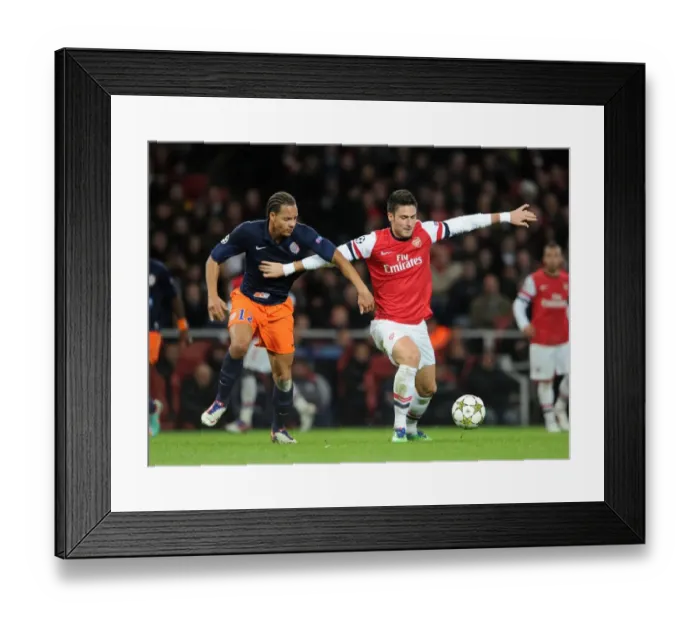 Framed Print : Arsenal's Olivier Giroud Fends Off Montpellier's Daniel Congre during Champions League Clash