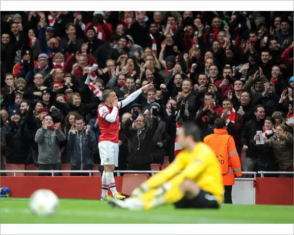 Lukas Podolski celebrates scoring Arsenals 2nd goal. Arsenal 2: 0 Montpellier. UEFA
