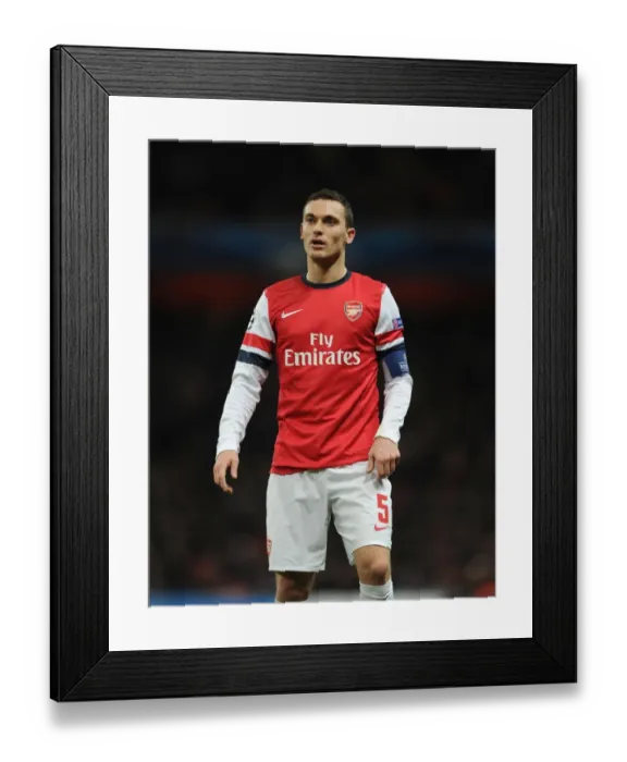 Framed Print : Thomas Vermaelen: Arsenal's Defensive Powerhouse in UEFA Champions League Clash Against Montpellier (2012-13)