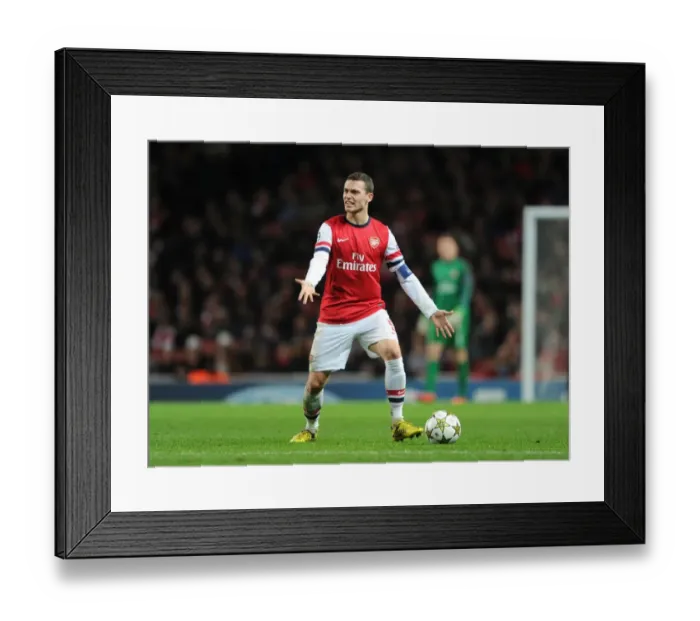 Framed Print : Thomas Vermaelen: Arsenal's Defensive Powerhouse in Action against Montpellier, UEFA Champions League 2012-13