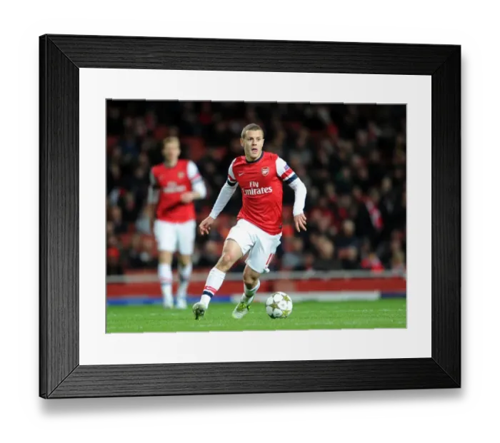 Framed Print : Jack Wilshere's Brilliant Performance: Arsenal's Midfield Mastermind Shines in UEFA Champions League Battle Against Montpellier (2012)