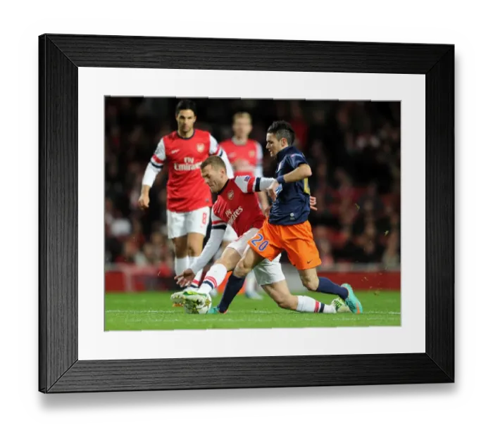 Framed Print : Arsenal's Jack Wilshere Tackles Montpellier's Remy Cabella in Champions League Clash Framed Print : Arsenal's Jack Wilshere Tackles Montpellier's Remy Cabella in Champions League Clash