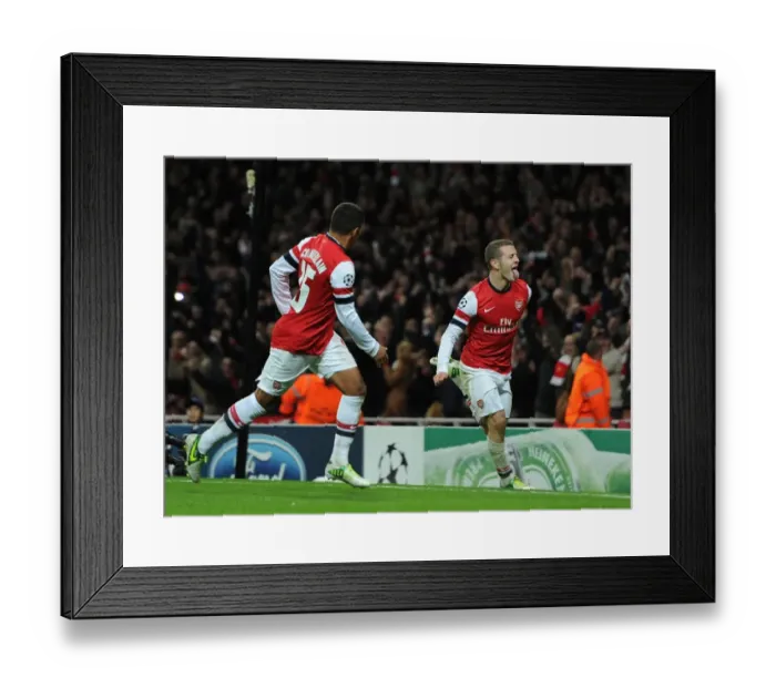 Framed Print : Arsenal's Wilshere and Oxlade-Chamberlain Celebrate First Goal in Champions League Match Against Montpellier (2012-13)