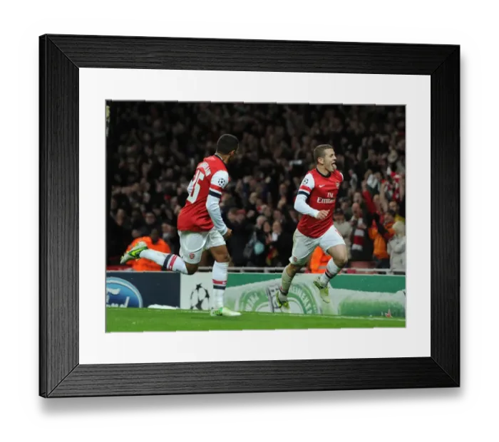 Framed Print : Arsenal's Wilshere and Oxlade-Chamberlain: Celebrating a Goal Against Montpellier (2012-13) Framed Print : Arsenal's Wilshere and Oxlade-Chamberlain: Celebrating a Goal Against Montpellier (2012-13)