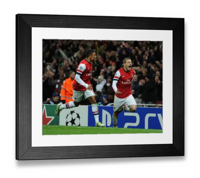 Framed Print : Arsenal's Jack Wilshere and Alex Oxlade-Chamberlain Celebrate First Goal Against Montpellier (2012-13) Framed Print : Arsenal's Jack Wilshere and Alex Oxlade-Chamberlain Celebrate First Goal Against Montpellier (2012-13)