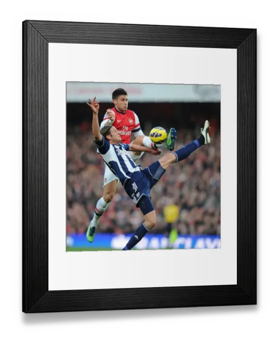Framed Print : Arsenal's Olivier Giroud Clashes with West Brom's Jonas Olsson in Premier League Showdown Framed Print : Arsenal's Olivier Giroud Clashes with West Brom's Jonas Olsson in Premier League Showdown