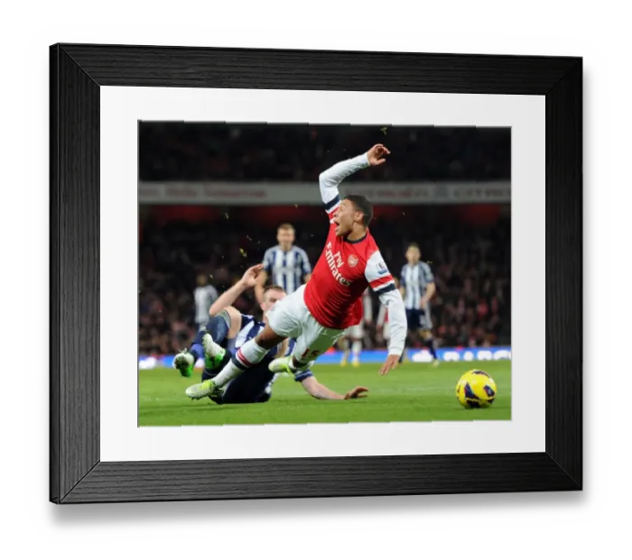 Framed Print : Arsenal's Alex Oxlade-Chamberlain Fouled by Chris Brunt in 2012-13 Arsenal v West Bromwich Albion Match Framed Print : Arsenal's Alex Oxlade-Chamberlain Fouled by Chris Brunt in 2012-13 Arsenal v West Bromwich Albion Match