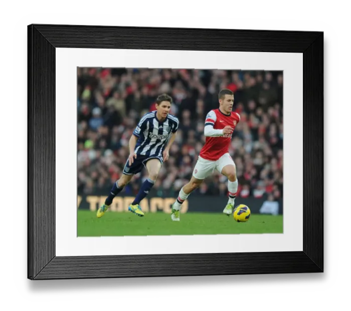 Framed Print : Arsenal's Jack Wilshere Outmaneuvers West Brom's Zoltan Gera during the 2012-13 Premier League Match Framed Print : Arsenal's Jack Wilshere Outmaneuvers West Brom's Zoltan Gera during the 2012-13 Premier League Match