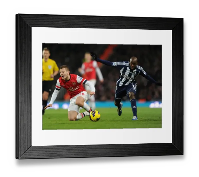 Framed Print : Arsenal's Jack Wilshere Fouls Youssouf Mulumbu in Premier League Clash (2012-13)