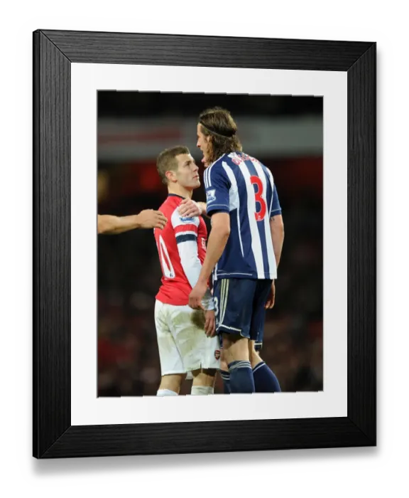 Framed Print : Jack Wilshere (Arsenal) Jonas Olsson (WBA). Arsenal 2: 0 West Bromwich Albion. Barclays