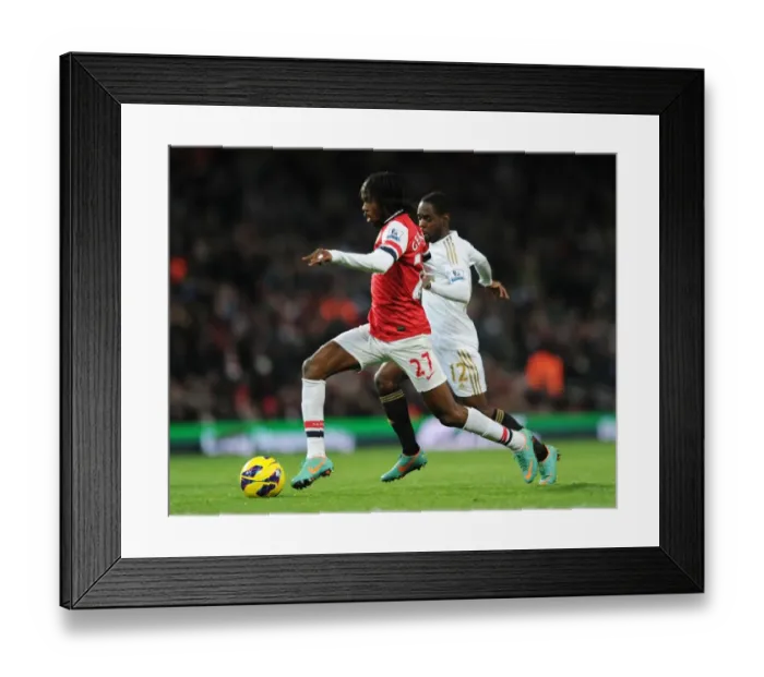 Framed Print : Arsenal vs Swansea: Gervinho vs Nathan Dyer Clash in the 2012-13 Premier League Framed Print : Arsenal vs Swansea: Gervinho vs Nathan Dyer Clash in the 2012-13 Premier League