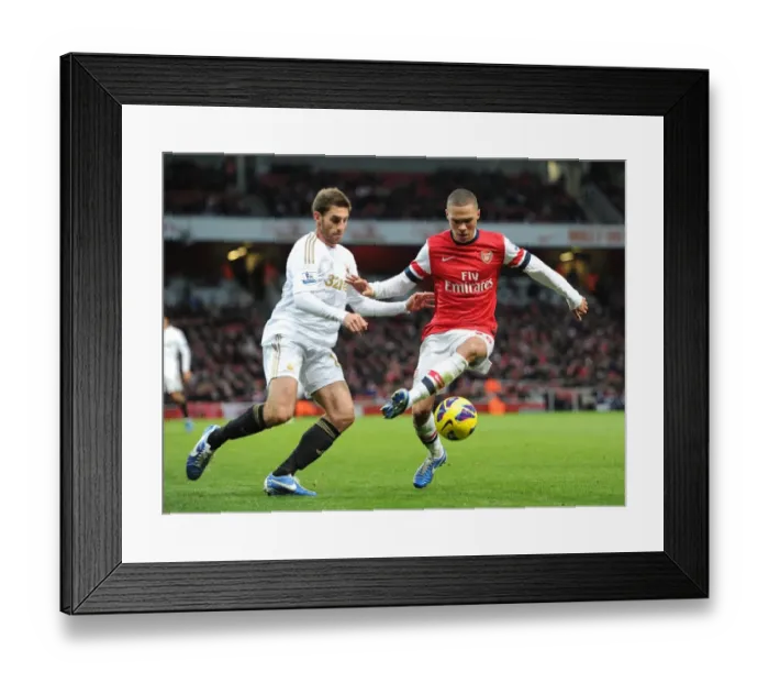 Framed Print : Arsenal's Kieran Gibbs Fends Off Swansea's Angel Rangel in Premier League Clash (2012-13)