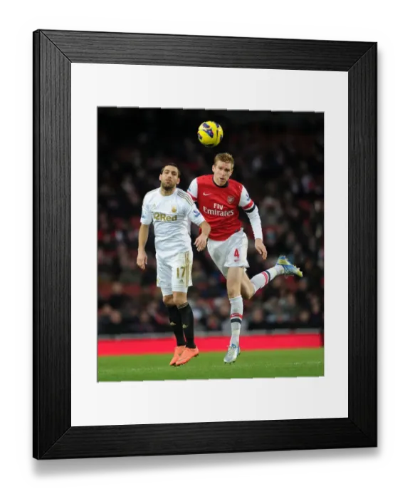 Framed Print : Per Mertesacker vs. Itay Shechter: Heading Clash at Arsenal vs. Swansea (2012-13)