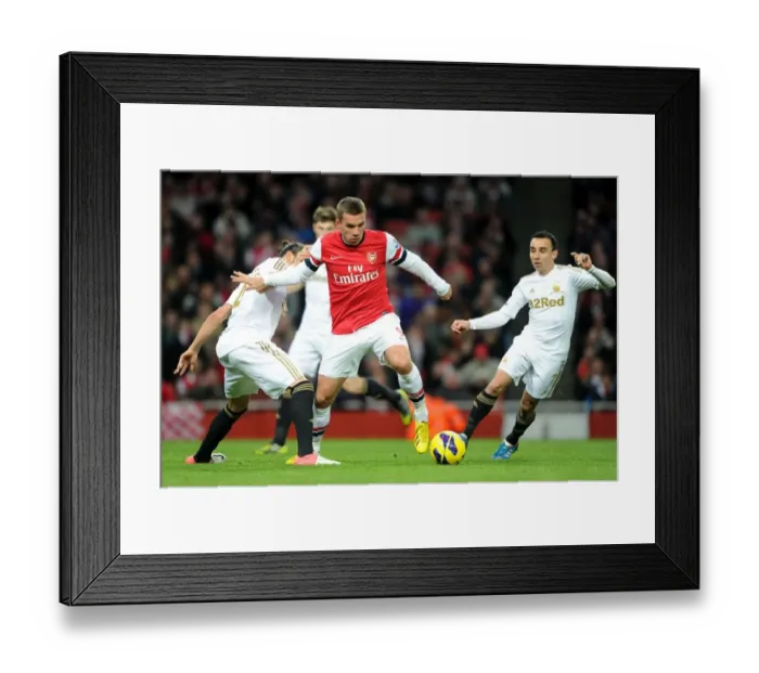 Framed Print : Arsenal's Lukas Podolski Fends Off Chico Flores and Leon Britton of Swansea during the 2012-13 Premier League Match