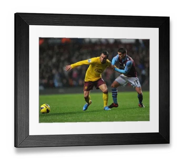 Framed Print : Clash of Midfield Maestros: Santi Cazorla vs. Ashley Westwood (Aston Villa vs. Arsenal, 2012-13) Framed Print : Clash of Midfield Maestros: Santi Cazorla vs. Ashley Westwood (Aston Villa vs. Arsenal, 2012-13)