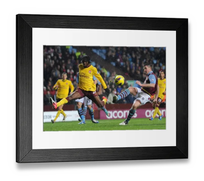 Framed Print : Gervinho (Arsenal) Ciaran Clark (Villa). Aston Villa 0: 0 Arsenal. Barclays Premier League