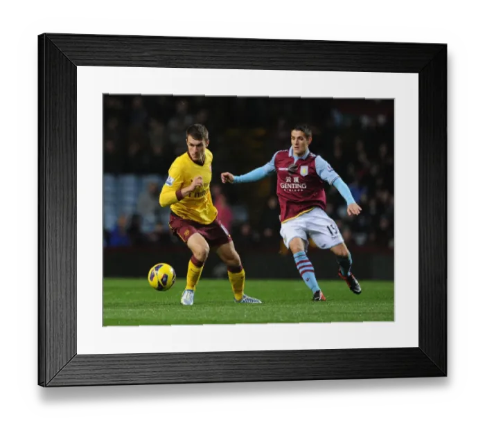 Framed Print : Aaron Ramsey vs. Ashley Westwood: Intense Battle at Villa Park (Aston Villa v Arsenal, Premier League 2012-13)