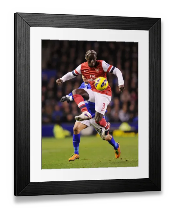 Framed Print : Battling Past: Sagna Outmaneuvers Pienaar in Everton vs Arsenal Clash (2012-13) Framed Print : Battling Past: Sagna Outmaneuvers Pienaar in Everton vs Arsenal Clash (2012-13)