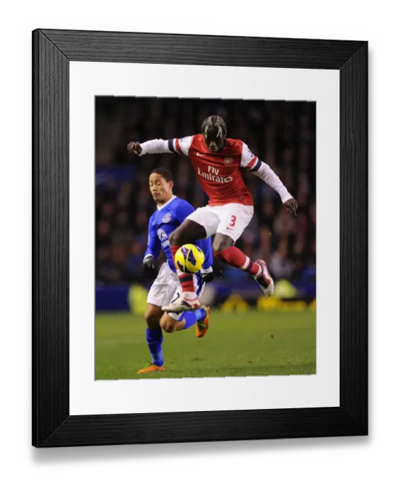 Framed Print : Bacary Sagna Outsmarts Steven Pienaar: A Premier League Showdown (2012-13) Framed Print : Bacary Sagna Outsmarts Steven Pienaar: A Premier League Showdown (2012-13)