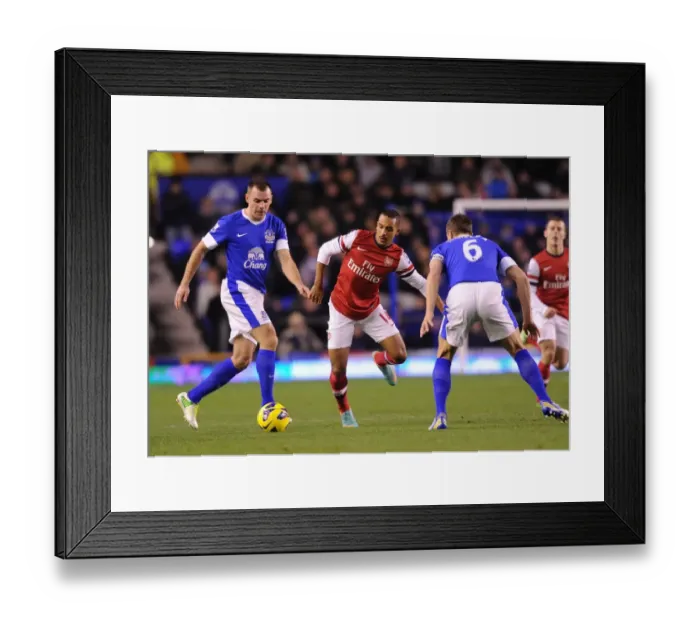 Framed Print : Theo Walcott Faces Off Against Darren Gibson and Phil Jagielka in Everton vs Arsenal Premier League Clash Framed Print : Theo Walcott Faces Off Against Darren Gibson and Phil Jagielka in Everton vs Arsenal Premier League Clash