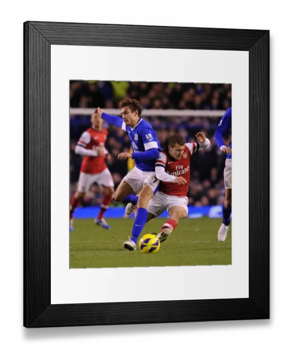 Framed Print : Wilshere vs Jelavic: Intense Battle at Goodison Park - Everton vs Arsenal, Premier League 2012-13