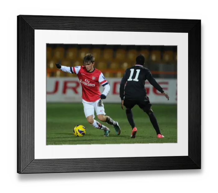 Framed Print : Arsenal's Olsson Outmaneuvers Bilbao's Williams in NextGen Series Clash