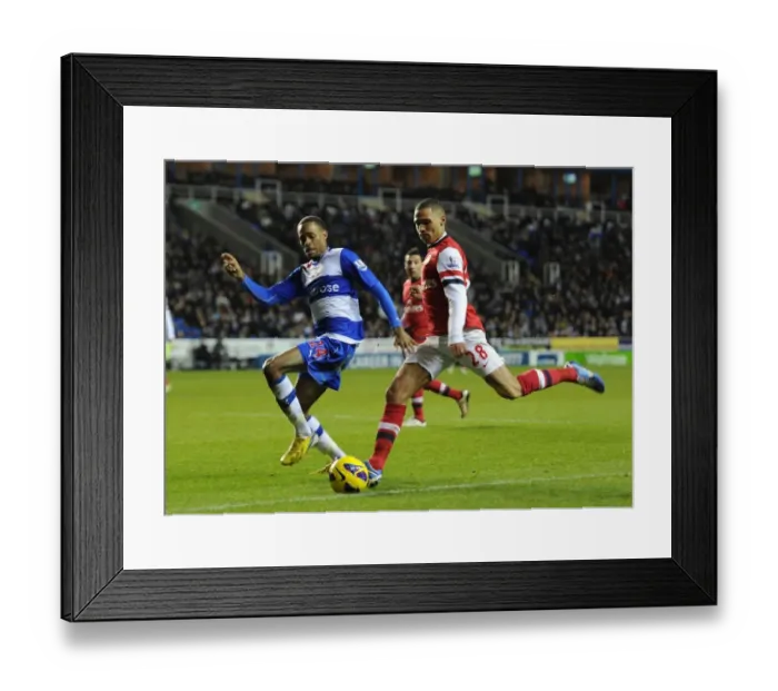 Framed Print : Arsenal's Kieran Gibbs Faces Off Against Reading's Shaun Cummings (2012-13)