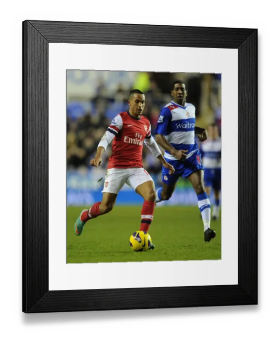 Framed Print : Theo Walcott Dashes Past Reading's Mikele Leigertwood in Arsenal's 2012-13 Premier League Clash Framed Print : Theo Walcott Dashes Past Reading's Mikele Leigertwood in Arsenal's 2012-13 Premier League Clash