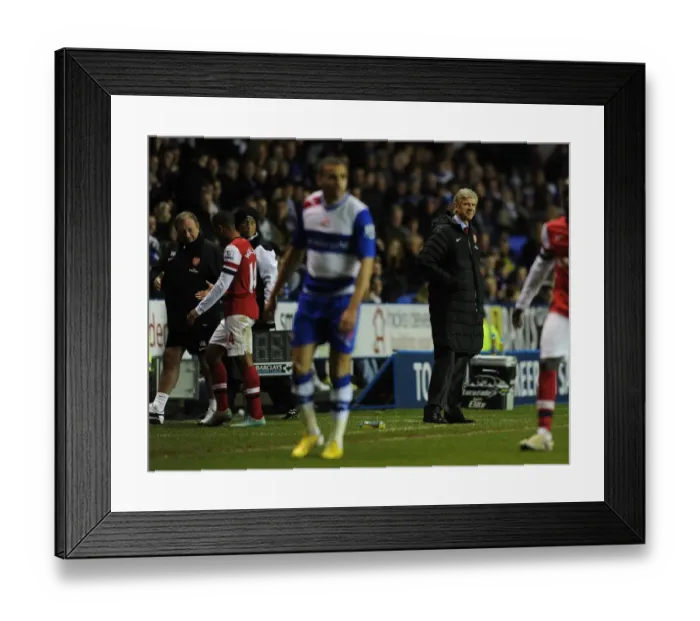 Framed Print : Arsene Wenger Watching Theo Walcott's Exit: Reading vs Arsenal (2012-13) Framed Print : Arsene Wenger Watching Theo Walcott's Exit: Reading vs Arsenal (2012-13)