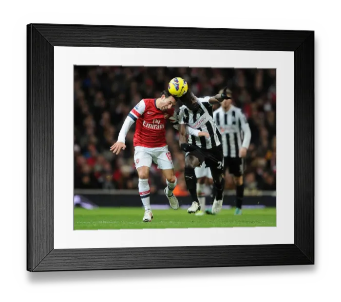 Framed Print : Clash of Midfield Titans: Santi Cazorla vs. Cheick Tiote (Arsenal vs. Newcastle United, 2012-13)