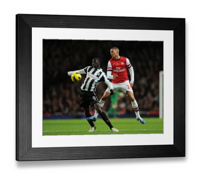 Framed Print : Arsenal vs Newcastle United: Kieran Gibbs vs Papiss Cisse - Intense Battle in the Premier League Framed Print : Arsenal vs Newcastle United: Kieran Gibbs vs Papiss Cisse - Intense Battle in the Premier League