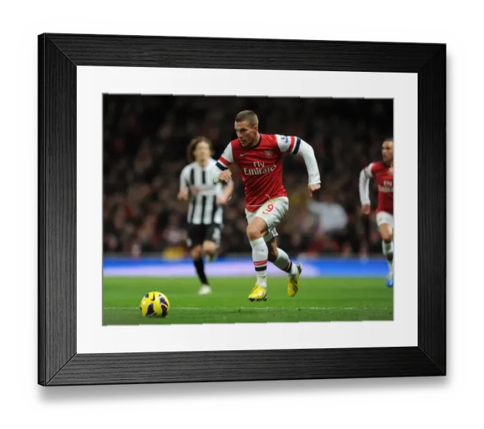 Framed Print : Lukas Podolski (Arsenal). Arsenal 7: 3 Newcastle United. Barclays Premier League. Emirates Stadium Framed Print : Lukas Podolski (Arsenal). Arsenal 7: 3 Newcastle United. Barclays Premier League. Emirates Stadium