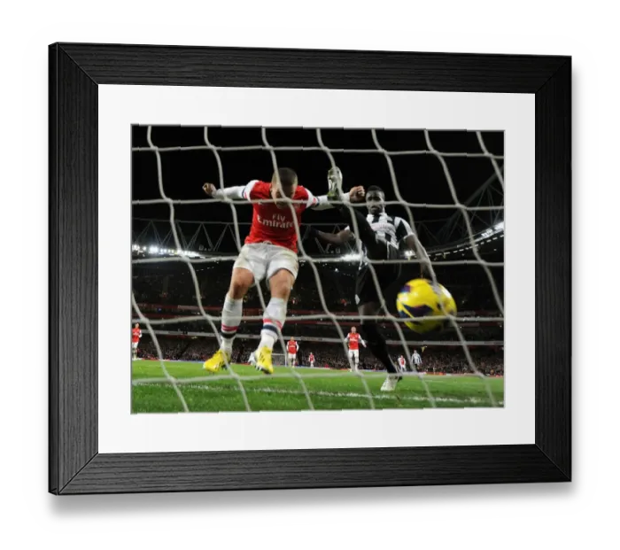 Framed Print : Podolski Scores the Third: Arsenal's Victory Over Newcastle United (2012-13) Framed Print : Podolski Scores the Third: Arsenal's Victory Over Newcastle United (2012-13)