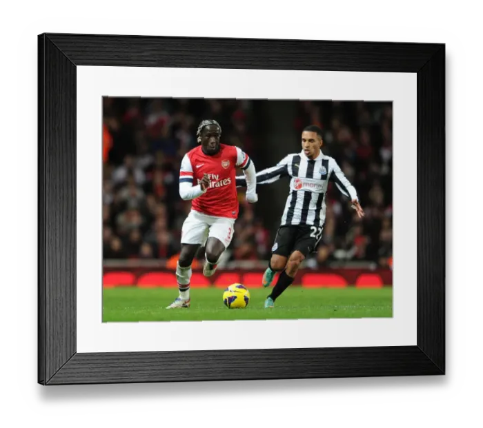 Framed Print : Arsenal's Bacary Sagna Clashes with Newcastle's James Tavernier in Premier League Showdown Framed Print : Arsenal's Bacary Sagna Clashes with Newcastle's James Tavernier in Premier League Showdown