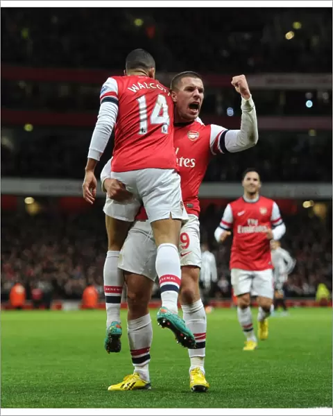 Theo Walcott and Lukas Podolski Celebrate Arsenal's First Goal vs. Newcastle United (2012-13)