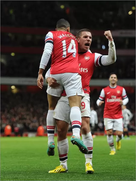 Theo Walcott and Lukas Podolski Celebrate Arsenal's First Goal vs. Newcastle United (2012-13)