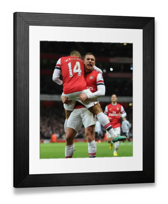 Framed Print : Arsenal's Star Duo: Walcott and Podolski Celebrate First Goal Against Newcastle United (2012-13) Framed Print : Arsenal's Star Duo: Walcott and Podolski Celebrate First Goal Against Newcastle United (2012-13)