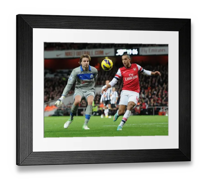 Framed Print : Arsenal's Theo Walcott Faces Off Against Newcastle's Tim Krul in Premier League Clash