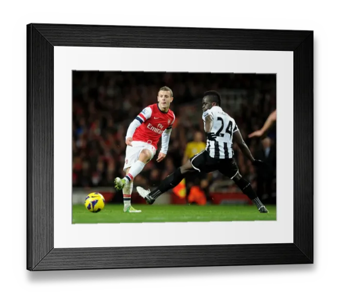 Framed Print : Arsenal's Jack Wilshere Fends Off Newcastle's Cheick Tiote: A Battle in the Midfield, December 2012
