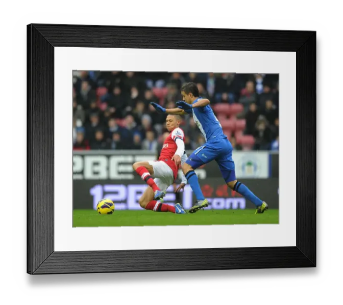 Framed Print : Arsenal's Kieran Gibbs Faces Off Against Wigan's Franco Di Santo in Premier League Clash (2012-13) Framed Print : Arsenal's Kieran Gibbs Faces Off Against Wigan's Franco Di Santo in Premier League Clash (2012-13)