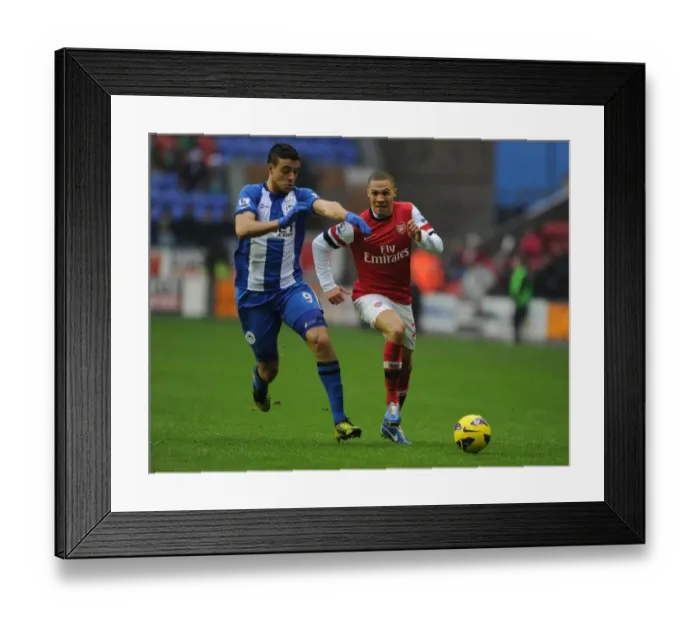 Framed Print : Arsenal's Kieran Gibbs Outruns Wigan's Franco Di Santo during the 2012-13 Premier League Clash Framed Print : Arsenal's Kieran Gibbs Outruns Wigan's Franco Di Santo during the 2012-13 Premier League Clash