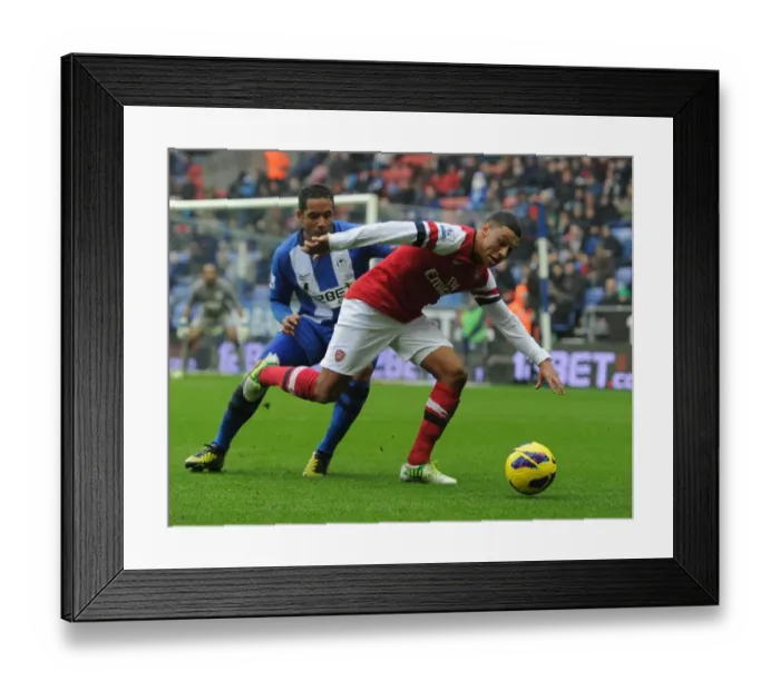 Framed Print : Clash of Wings: Oxlade-Chamberlain vs. Beausejour in Wigan Athletic vs. Arsenal