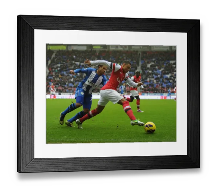 Framed Print : Alex Oxlade-Chamberlain Outmaneuvers Jean Beausejour: Wigan Athletic vs Arsenal, Premier League 2012-13 Framed Print : Alex Oxlade-Chamberlain Outmaneuvers Jean Beausejour: Wigan Athletic vs Arsenal, Premier League 2012-13
