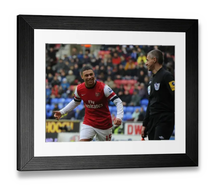 Framed Print : Alex Oxlade-Chamberlain's Light-Hearted Moment Amidst Wigan Athletic vs Arsenal Tension (2012-13) Framed Print : Alex Oxlade-Chamberlain's Light-Hearted Moment Amidst Wigan Athletic vs Arsenal Tension (2012-13)
