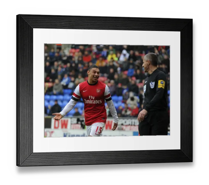 Framed Print : Alex Oxlade-Chamberlain's Light-Hearted Moment: A Humorous Break in the Intense Wigan Athletic vs Arsenal Clash (2012-13) - Arsenal's Star Player Jokes with the Referee's Assistant Framed Print : Alex Oxlade-Chamberlain's Light-Hearted Moment: A Humorous Break in the Intense Wigan Athletic vs Arsenal Clash (2012-13) - Arsenal's Star Player Jokes with the Referee's Assistant