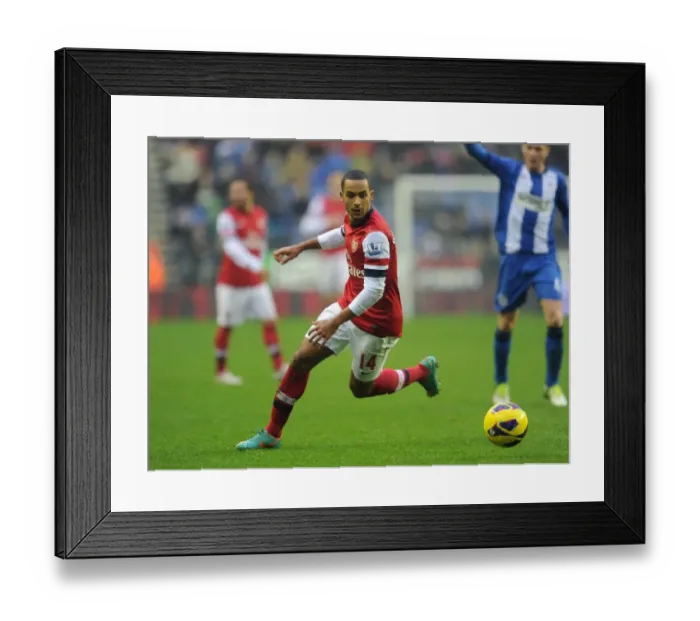 Framed Print : Theo Walcott (Arsenal). Wigan Athletic 0: 1 Arsenal. Barclays Premier League. The DW Stadium Framed Print : Theo Walcott (Arsenal). Wigan Athletic 0: 1 Arsenal. Barclays Premier League. The DW Stadium