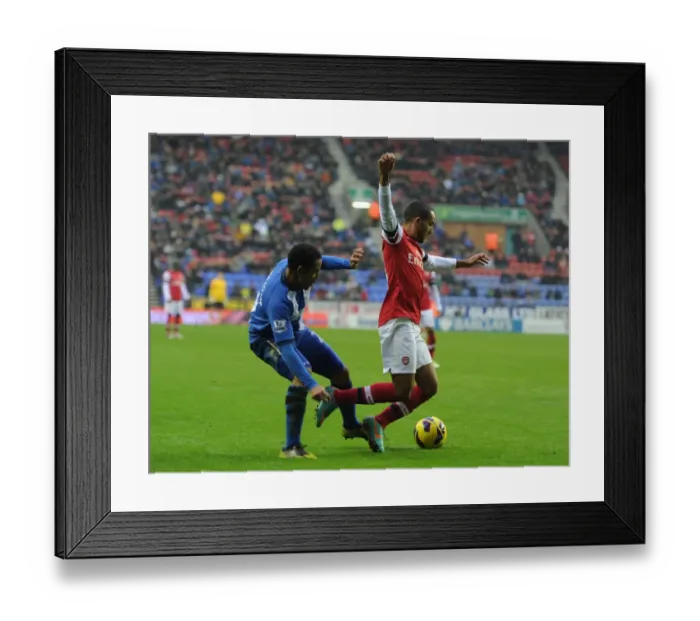Framed Print : Theo Walcott vs. Jean Beausejour: Penalty Drama at Wigan Athletic vs. Arsenal (2012-13) Framed Print : Theo Walcott vs. Jean Beausejour: Penalty Drama at Wigan Athletic vs. Arsenal (2012-13)