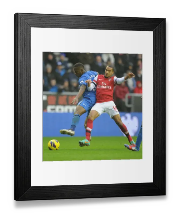 Framed Print : Theo Walcott vs. Maynor Figueroa: Battle at DW Stadium - Wigan Athletic vs. Arsenal, Premier League, 2012-13 Framed Print : Theo Walcott vs. Maynor Figueroa: Battle at DW Stadium - Wigan Athletic vs. Arsenal, Premier League, 2012-13
