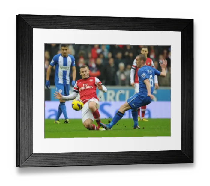 Framed Print : Wilshere vs Jones: Intense Battle in Wigan Athletic vs Arsenal Premier League Clash Framed Print : Wilshere vs Jones: Intense Battle in Wigan Athletic vs Arsenal Premier League Clash
